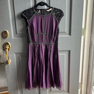 Lace back, high neck, bordered with silver gems